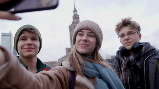 Teenagers sightseeing city of Warsaw in on winter day