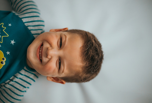 portrait of smiling boy isolated on white background
