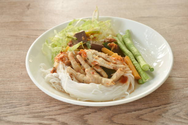 istock rice noodles with spicy chicken curry sauce and fresh vegetable 1901963040