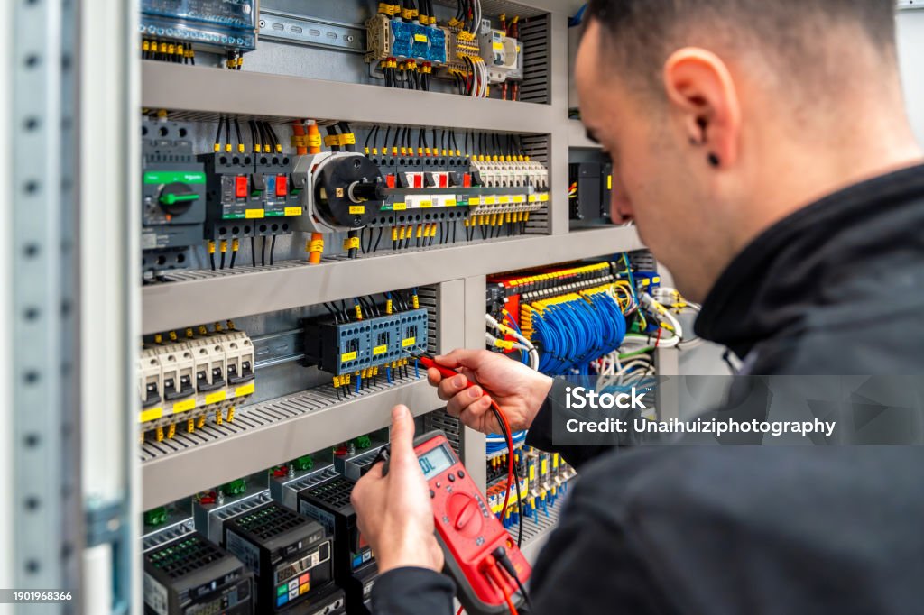 Electrical Engineering Panel Closeup Of An Engineer Repairing An Electrical System Panel Stock Photo ...
