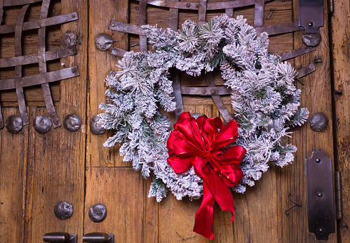 Santa Fe, NM: White Christmas Wreath on Antique Brown Door