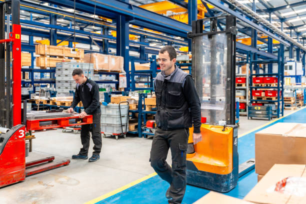 istock Male handling workers in a logistic factory 1901982311