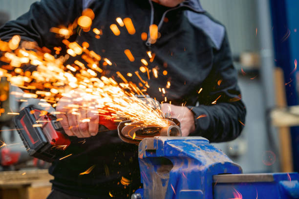 istock Man working with electric grinder tool on steel structure 1901985470