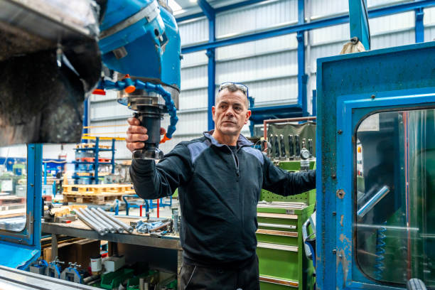istock Engineer working in front of automated CNC machine 1901985471