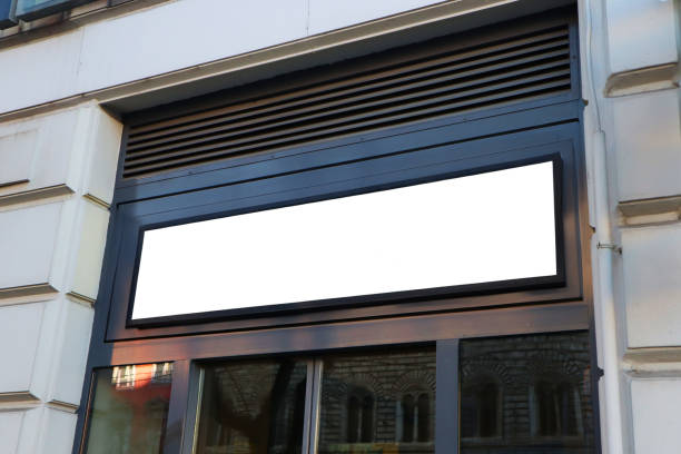Blank billboard sign mockup in the urban environment on old building, facade, empty space to display your advertising or branding campaign