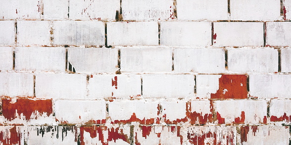 Abstract Red White Brick Wall Vintage Background. Peeling Pint on Red Brick Wall