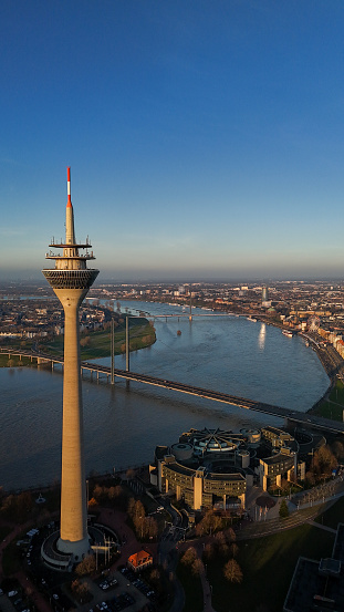 The Rhine Tower, Dusseldorf's most recognisable landmark created by architect H. Deilmann and build in 1979 – 1982, is situated on the edge of the city centers southern district at the entrance to the Media Harbour, directly next to the North Rhine-Westphalian state parliament. Positioned at the top of the tower at a height of 172.5 metres, is QOMO, a restaurant featuring 144 seats, rotating around its own axis once every 72 minutes.
