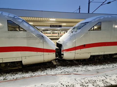 München Hauptbahnhof or Munich Central Station is the main railway station in the city of Munich, Germany. München Hauptbahnhof sees about 450,000 passengers a day. The image shows an ICE 2  train at the station captured during heavy snowfall.