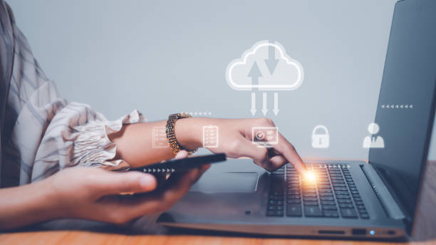 istock Woman use computer with cloud computing diagram show on hand.Download, upload, backup wireless conceptual,Networking and internet service concept. 1902054584