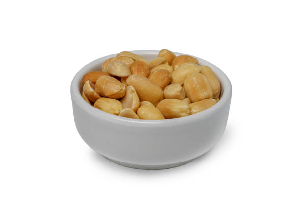 istock Small bowl of roasted salted peanuts isolated on white background. with Clipping path. 1902055624