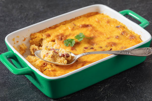 istock cheesy smoked sausage grits bake in ceramic dish 1902088070
