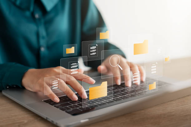 istock Document management system concept, business woman using laptop, folders and document icon software, online document database file management Powerful company information Search and archive. 1902100645