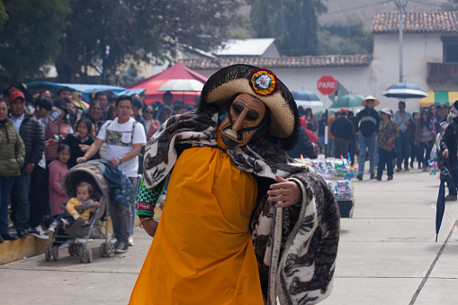 The huaconada is a traditional dance that represents the warrior elders and is danced in Mito, Peru. The dancers wear wooden masks and a typical Peruvian blanket.