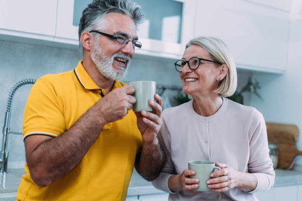 istock Lovely couple drinking coffee at home. 1902114138
