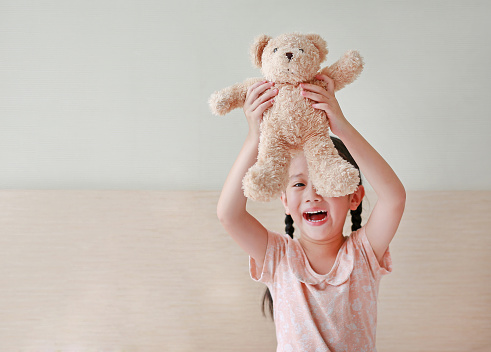 Cute Little Girl and Teddy Bear