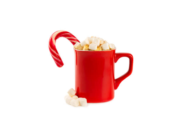 istock Hot drink with marshmallows and candy cane in cup isolated on a white background.Cozy seasonal holidays.Hot cocoa with gingerbread Christmas cookies.Hot chocolate with marshmallow and spices. 1902136216