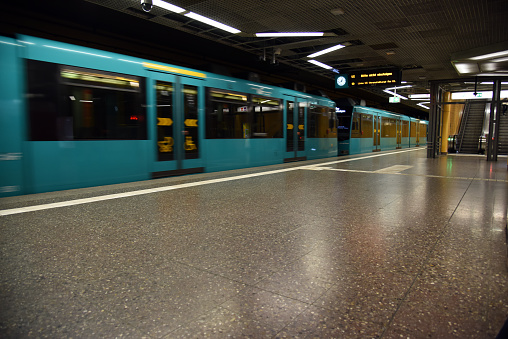 The image shows a train in the U-Bahn Frankfurt am Main. Thhe underground network consists of 86 stations on nine lines, with a total length of 64.85 kilometres.
