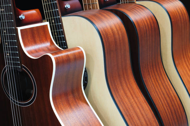 istock Acoustic guitars stand in a row 1902189634