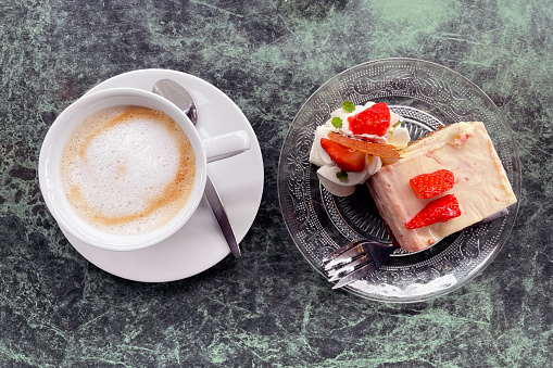 Cappuccino cup with cake