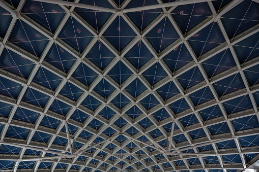 The geometric steel ceiling of a train station