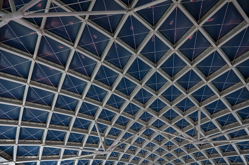 The geometric shape of the metal ceiling at the train station