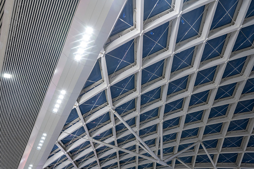 The geometric steel ceiling of a train station