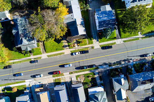 In small American town, an aerial view road with cars