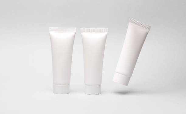 istock Mockup of three white cream tubes on white background. Template for design 1902238998