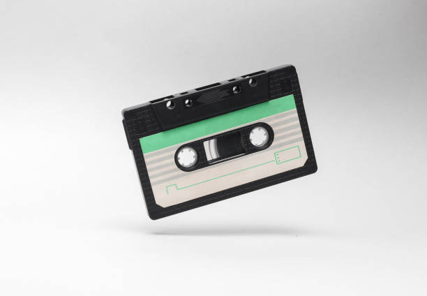 istock Retro audio cassette levitating on white background. Minimalism 1902239508
