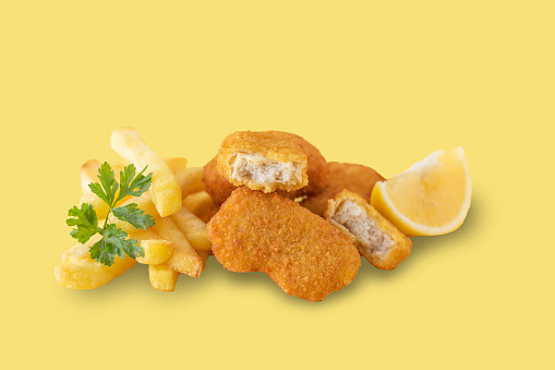 Chicken nuggets  on a yellow  backgound