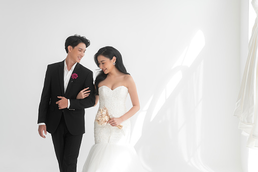 Close-Up Of Couple Holding Hands with wedding rings