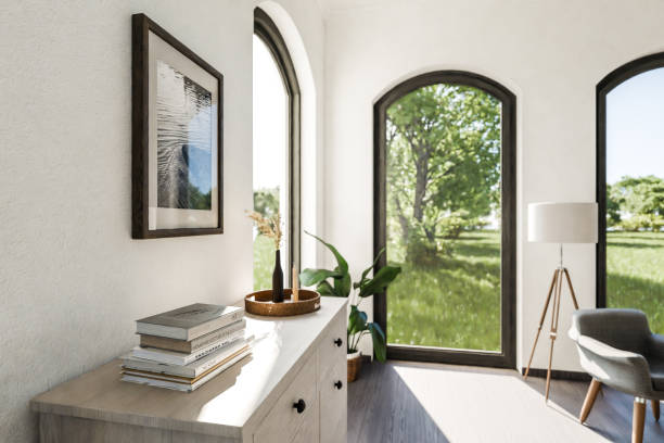 luxurious loft apartment with floor-to-ceiling windows and panoramic view; modern minimalistic interior design of living room and dining room area; bright daylight; 3D rendering