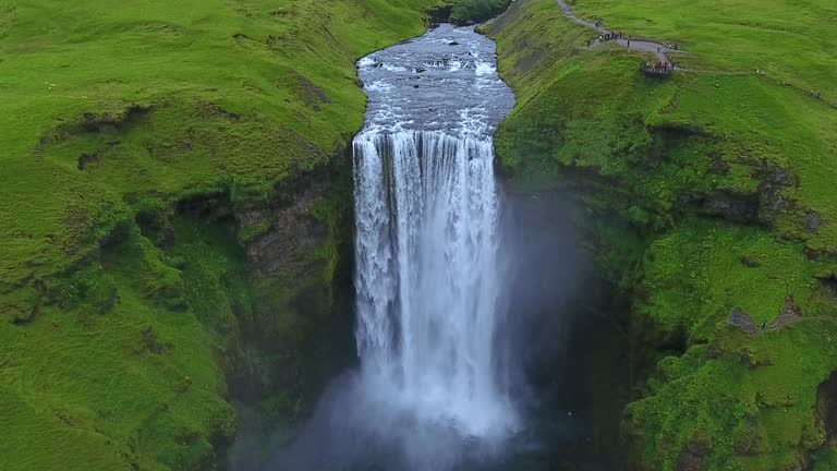 Aerial view of Skogafoss waterfall in green Icelandic landscape