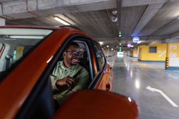 istock Safety first! A Black man is fastening a seat belt. 1902322418