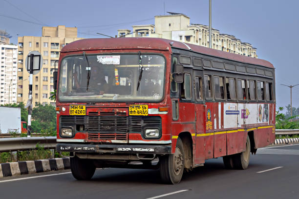 Pune , Maharashtra, India-November 14th, 2023: Old , Maharashtra State transport bus speeding on highway Text in local language on number plate is MH14 BT 4260.