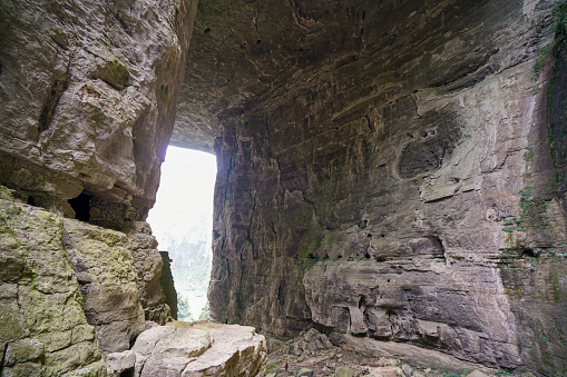 Natural holes formed due to time and weathering. There are tourist trails below. The Three Natural Bridges are a series of natural limestone bridges, Chongqing.