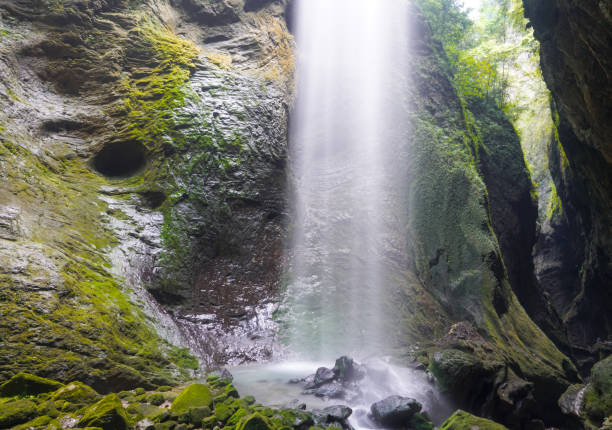 istock Waterfalls in the canyon fall from the sky. Like a silver-white chain. 1902360688