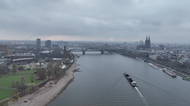 Aerial view of downtown Cologne city center. River rhine, skyline, Cologne Cathedral and the Hohenzollernbrucke. Train station and infrastructure.