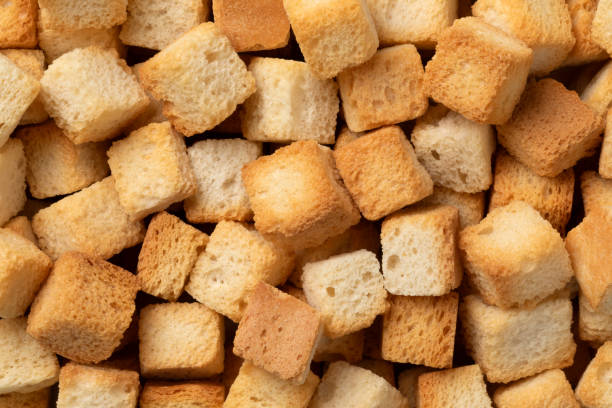 Fresh baked croutons for seasoning close up full frame