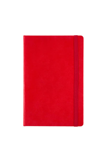 istock Red closed blank paper notebook planner isolated on white background. Design template of copybook with elastic band for mockup. Top view. 1902437995