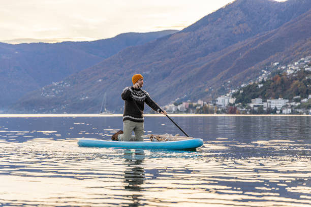 istock Man stand up paddling on a lake 1902454532