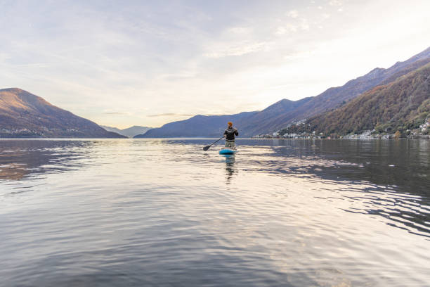 istock Man stand up paddling on a lake 1902455568