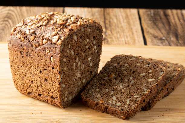 istock Grain black bread with sunflower seeds. 1902463311