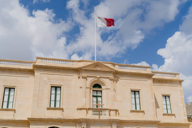 istock Maltese flag on a building against the sky. 1902465177