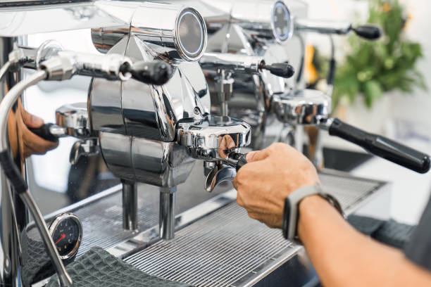 istock Espresso machine making hot coffee on counter in coffee shop 1902469156