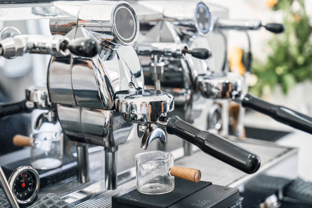 istock Espresso machine making hot coffee into dosing cup in coffee shop 1902469675