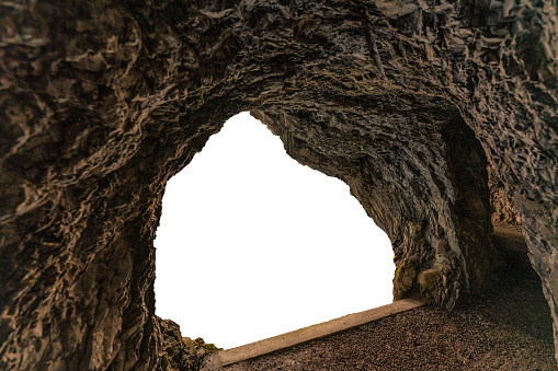 Natural linestone cave, underground mine tunnel and white background