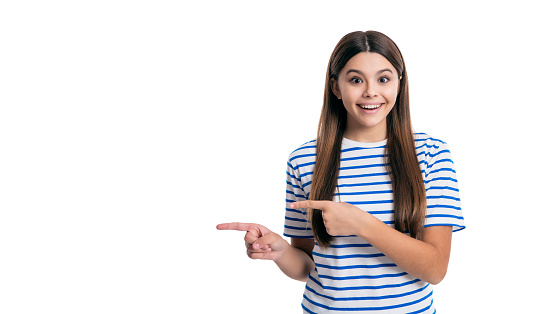 fashion style of teen girl wear tshirt pointing finger. teen style of pretty girl. teen girl style isolated on white background. style of teen girl in studio.