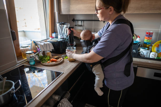 istock Mother preparing food with a blender to her baby 1902541221