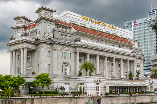 The iconic colonial Fullerton Hotel located on the waterfront of downtown Singapore